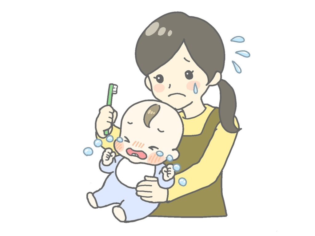 赤ちゃんの口腔ケアをする母親