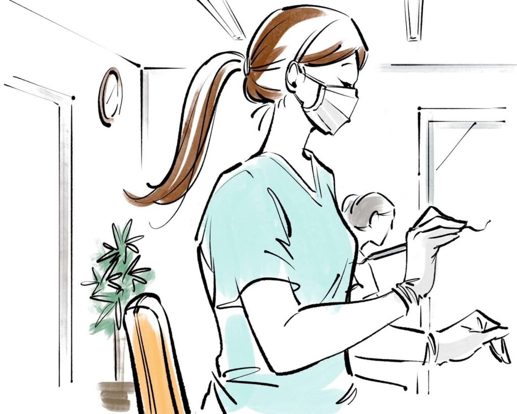 診察をする歯科医師の女性