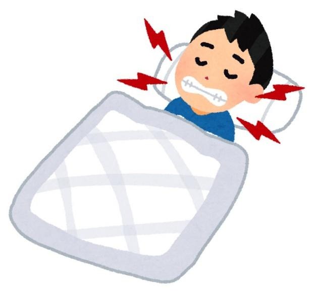 歯ぎしりをする男性